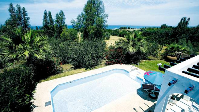 The views out over the swimming pool to the sea from Villa Argaka