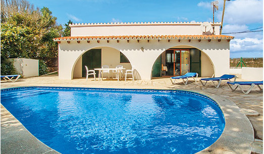 Relax by the swimming pool at Villa Chiquita on Menorca